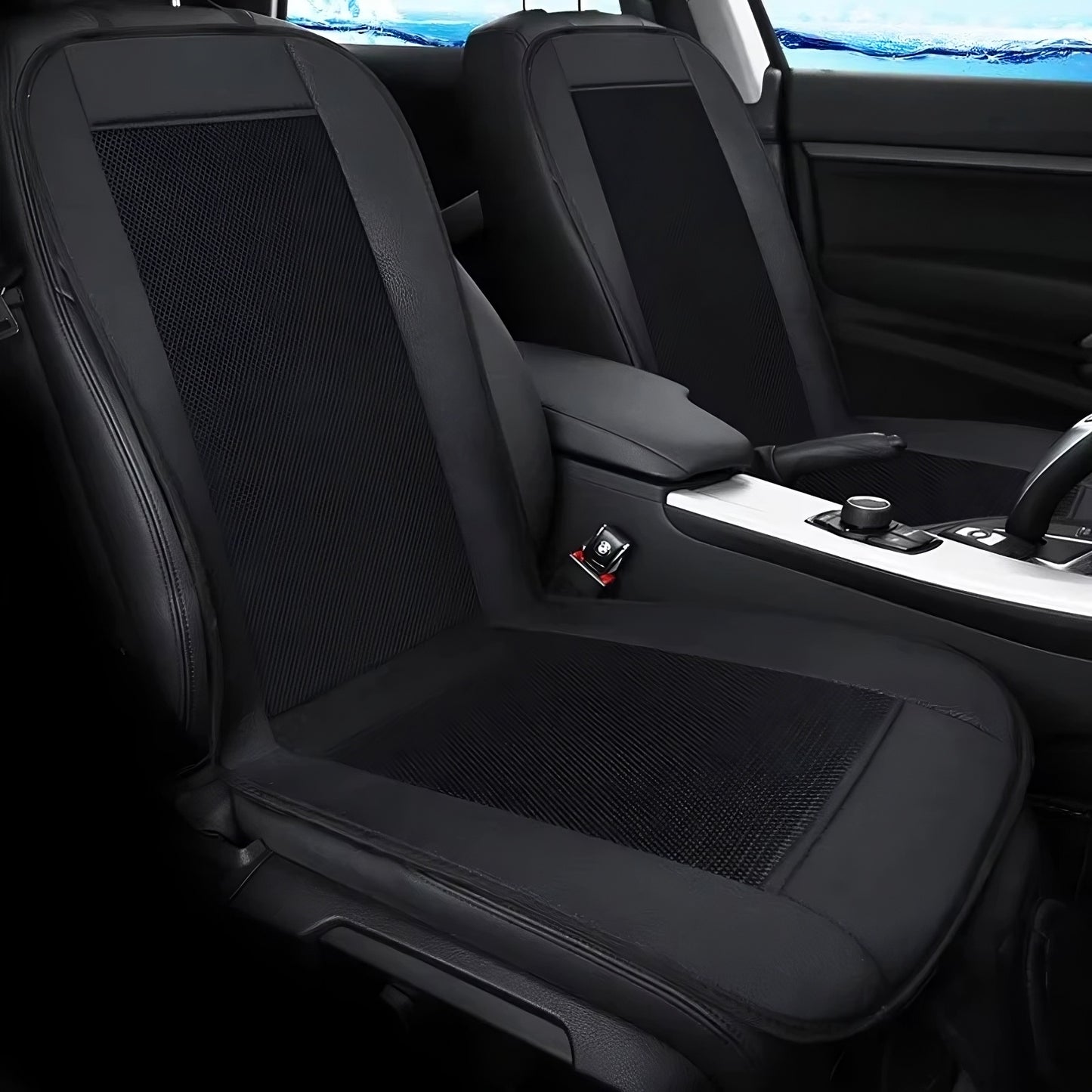 Black car seat cover with mesh design on a vehicle interior.