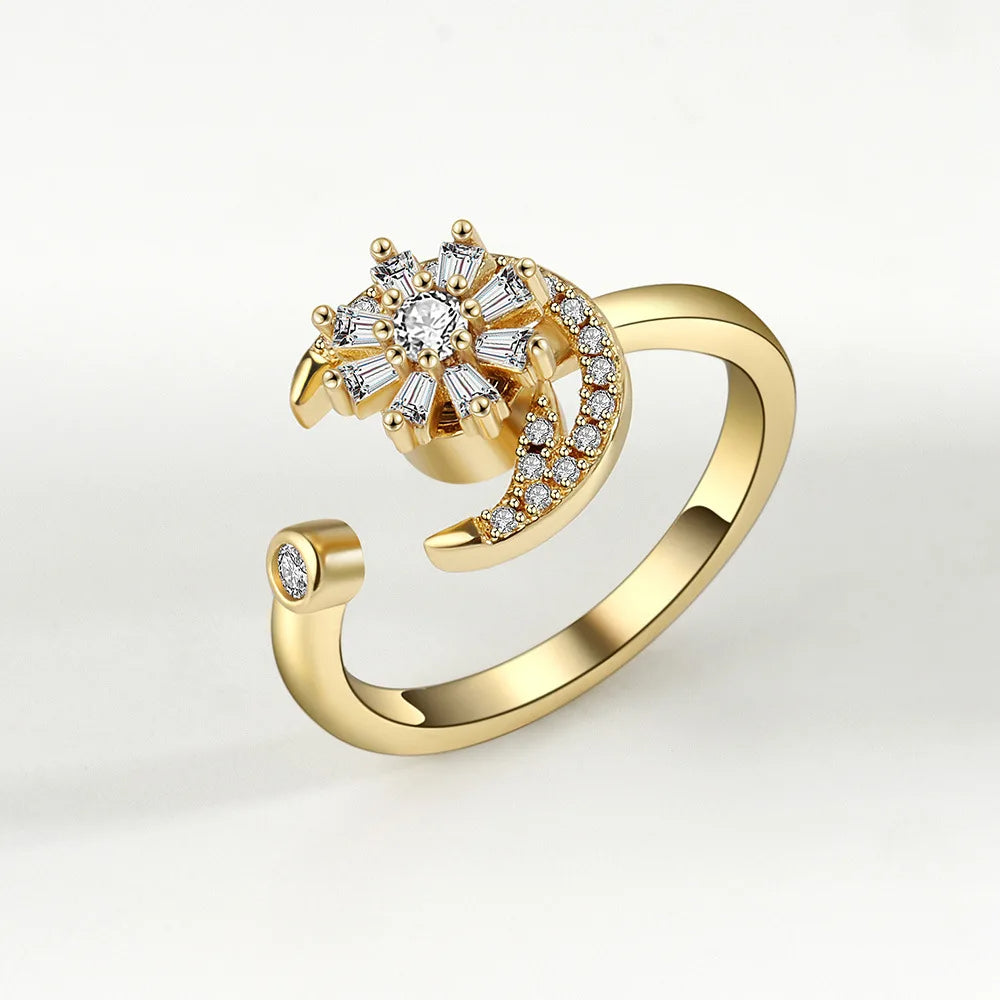 Gold ring with diamond accents on a light gray background