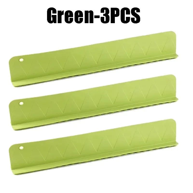 Three green sink protectors