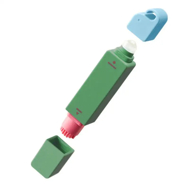 Green stain remover pen with pink cap on a white background