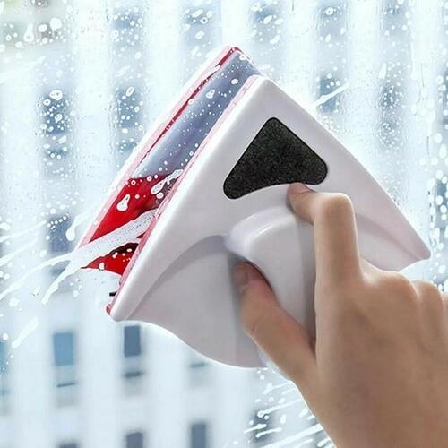Hand using a Magnetic Window Wiper tool