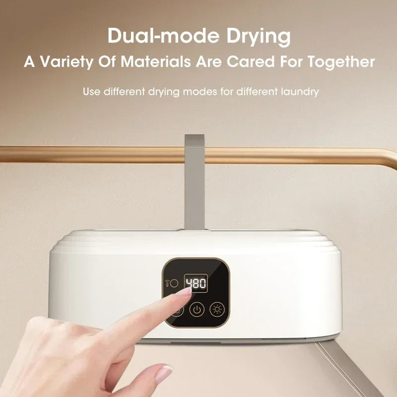 White dryer with digital display and hand interacting with it, on a beige background.