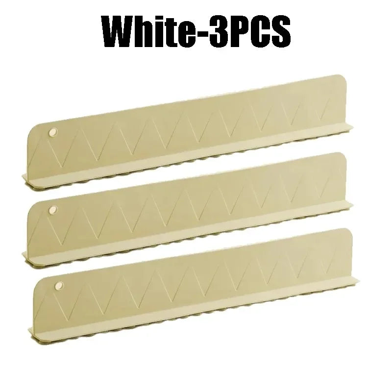 Three white green sink protectors