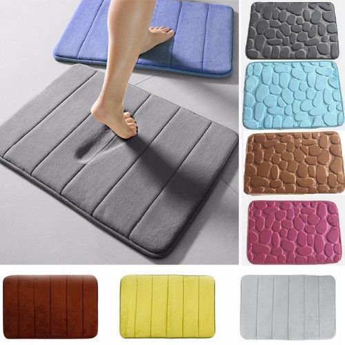 Collage of bath mats in various colors with a foot stepping onto a gray mat.