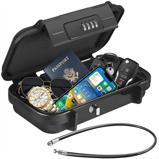 Black security lock box with items like a phone, passport, keys, and watch inside on a white background.