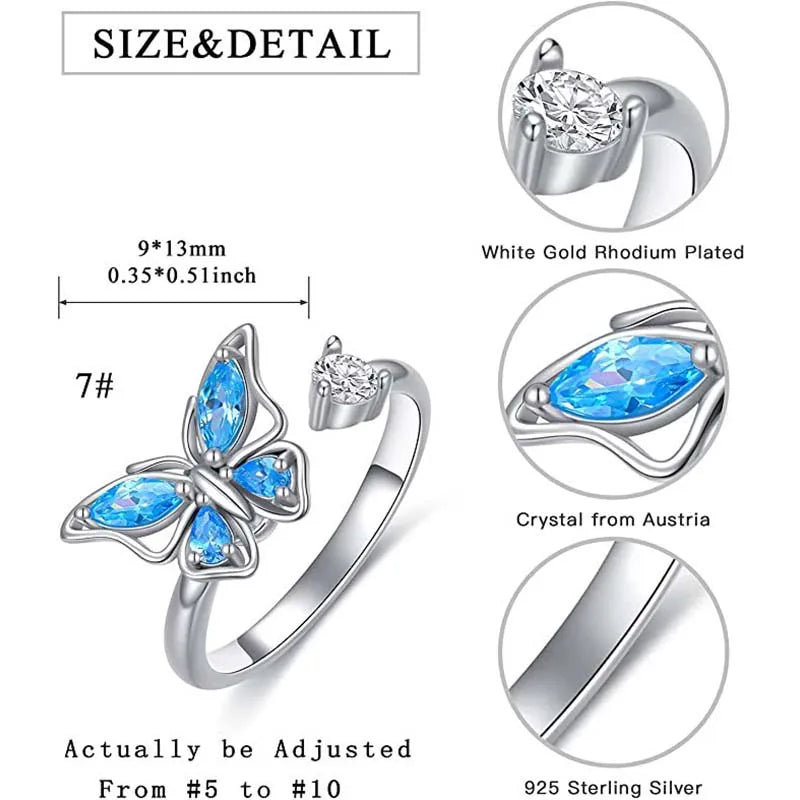 Butterfly-shaped ring with blue gemstones and white gold rhodium plating, featuring size and detail information.