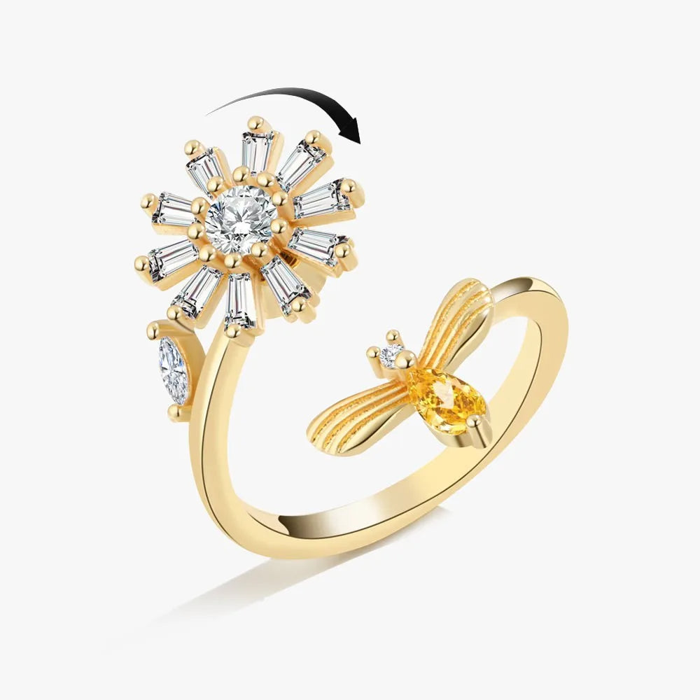 Gold ring with diamond accents on a white background