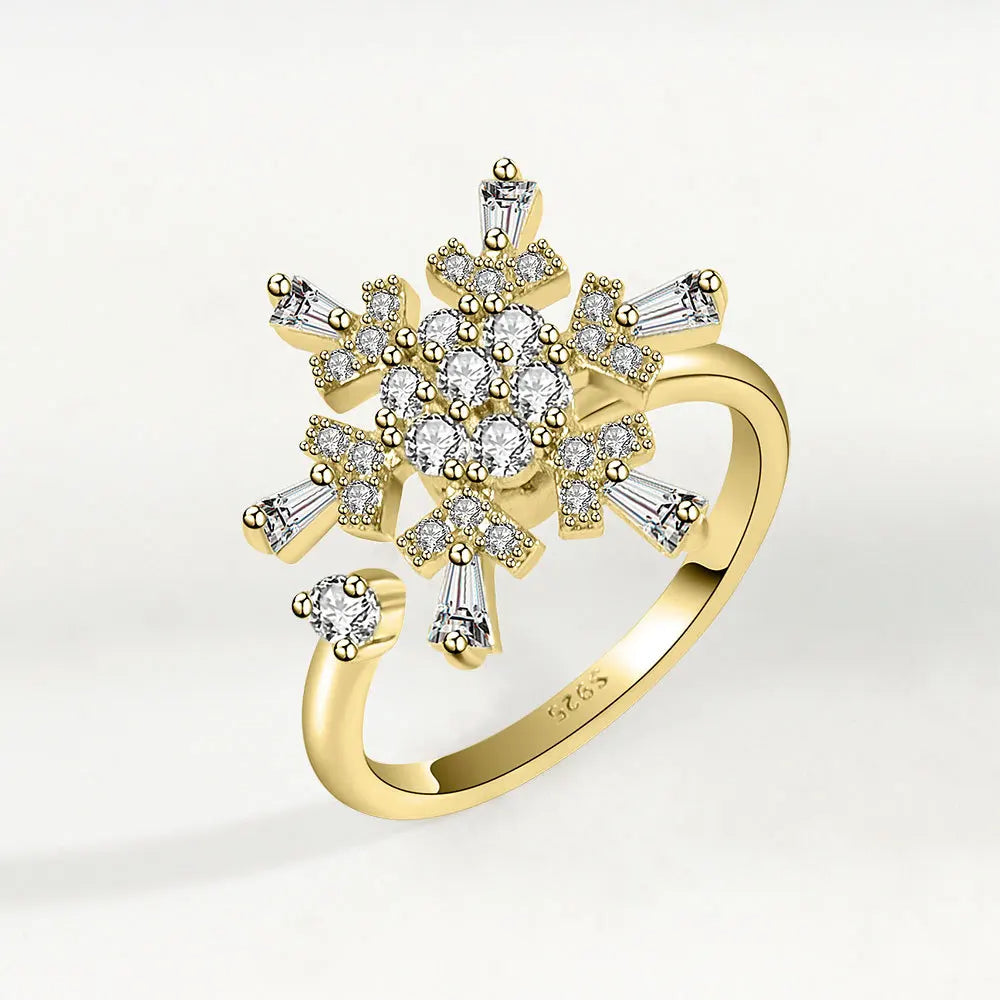 Gold ring with diamond accents on a white background