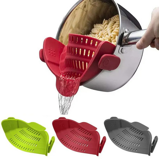 Red silicone strainer being used to drain pasta from a pot, with additional green and gray strainers shown below.