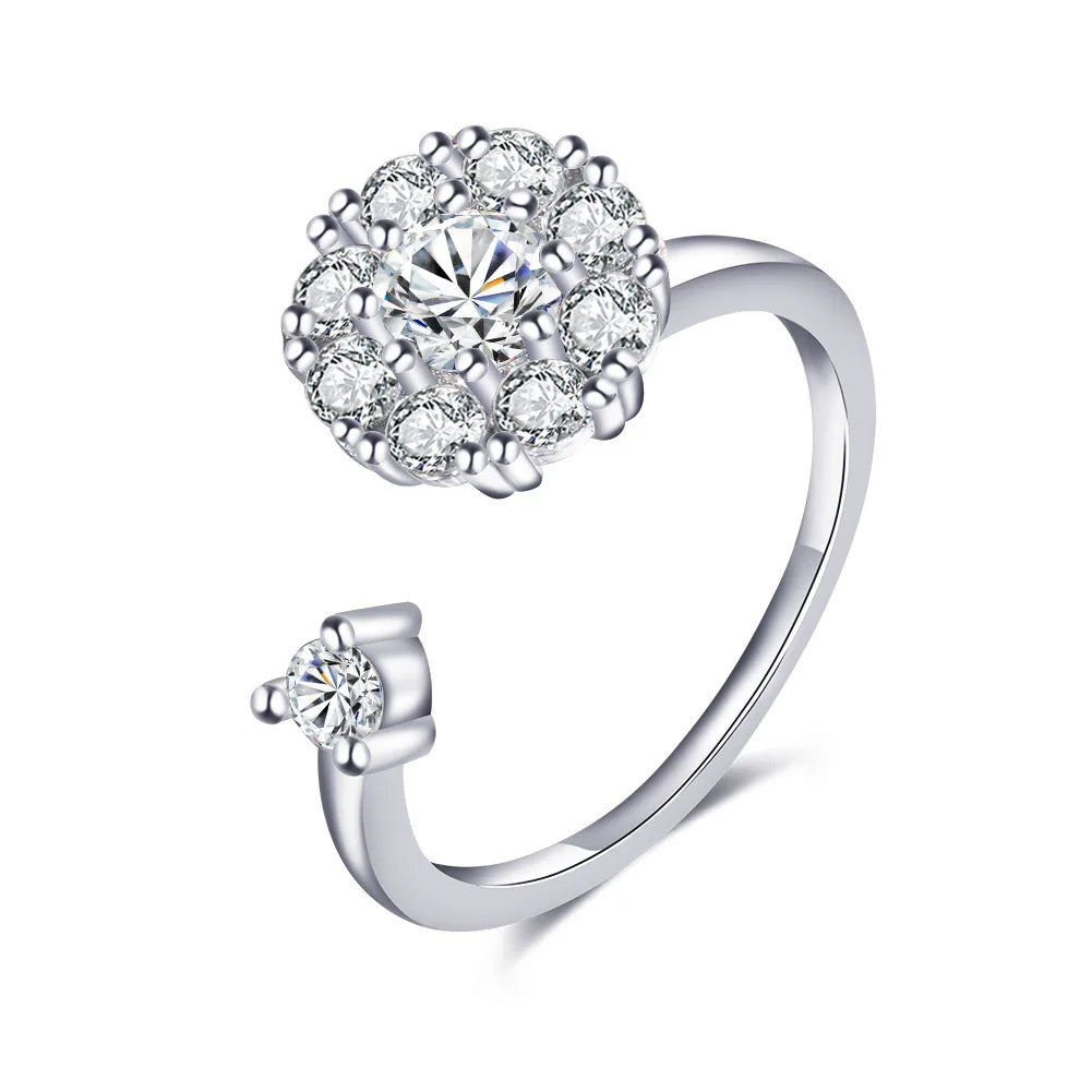 Silver ring with diamond-like stones on a white background