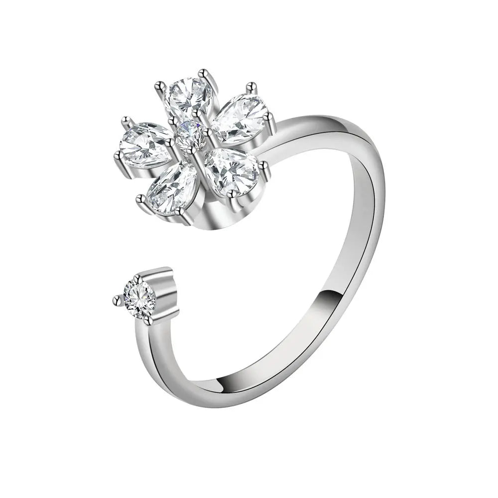 Silver ring with diamond-like stones on a white background