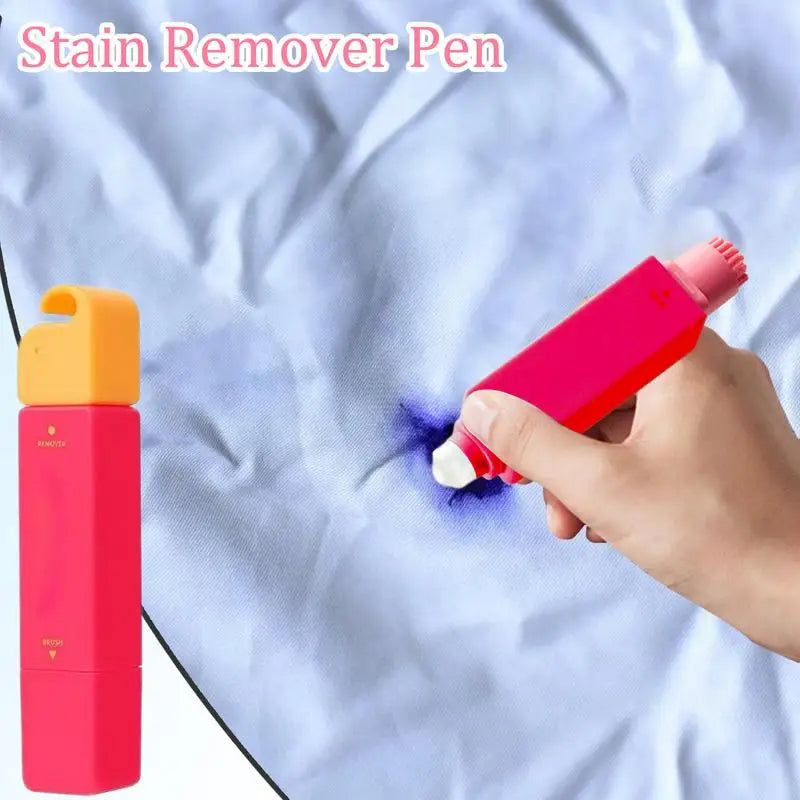 Stain remover pen being used on a fabric with a visible stain, next to its packaging.