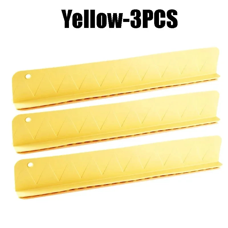 Three yellow sink protectors